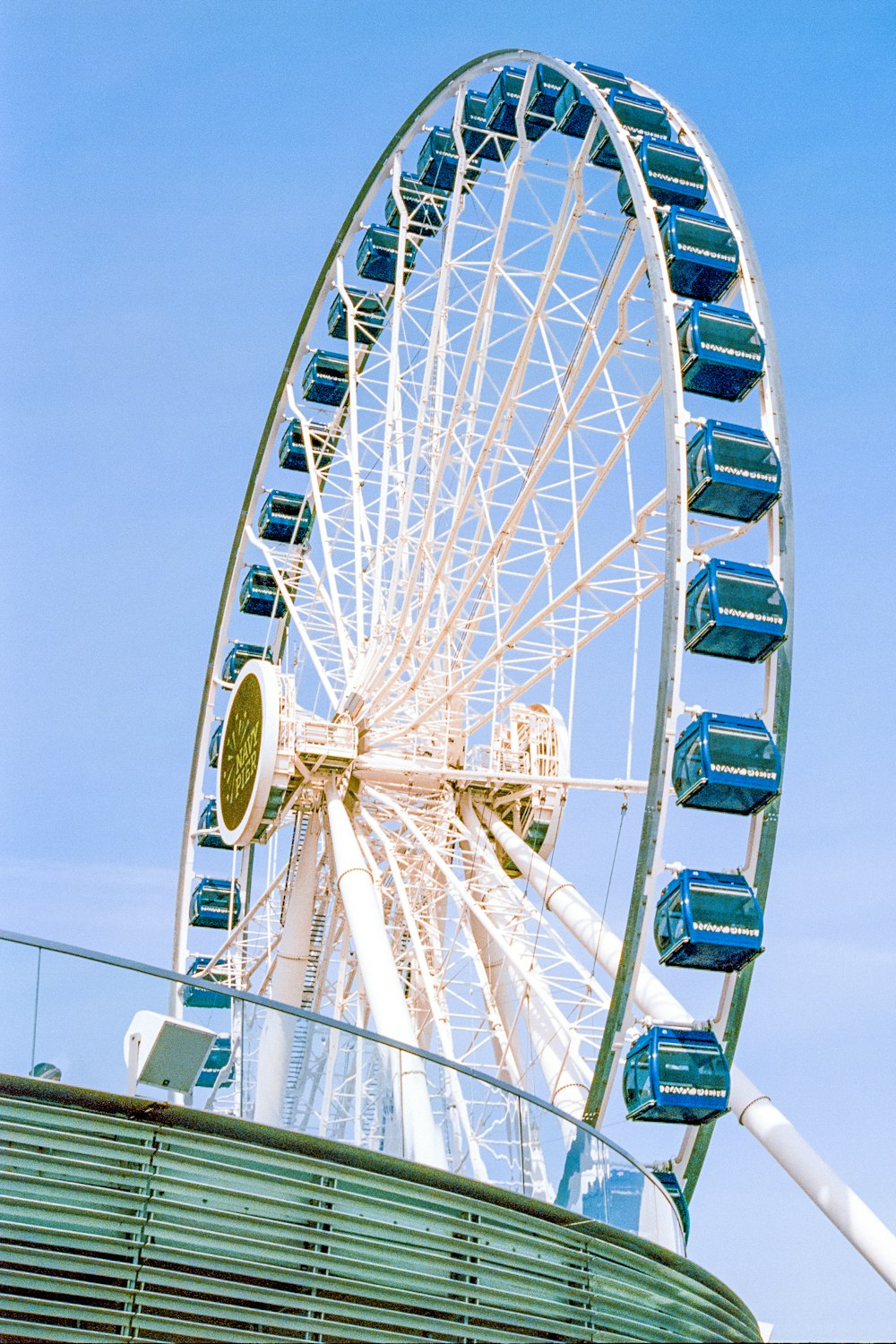 a large ferris wheel on top of a building