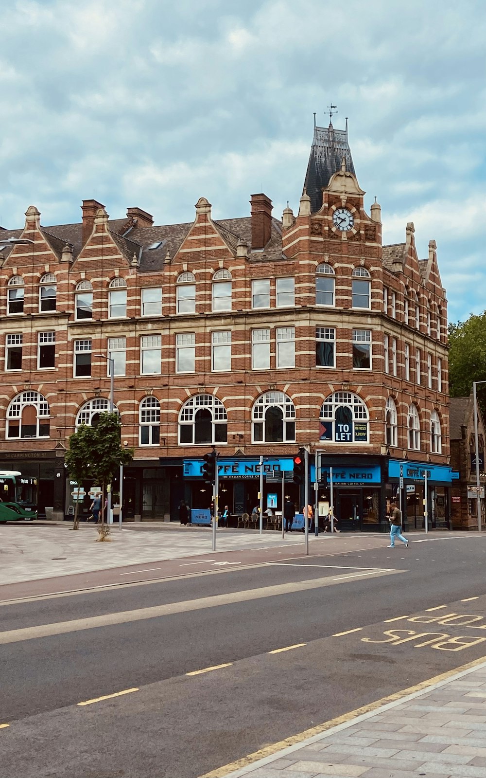 a large brick building with a clock tower on top