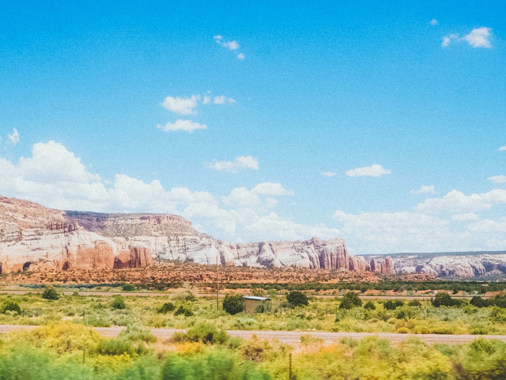 a view of a mountain range from a train window