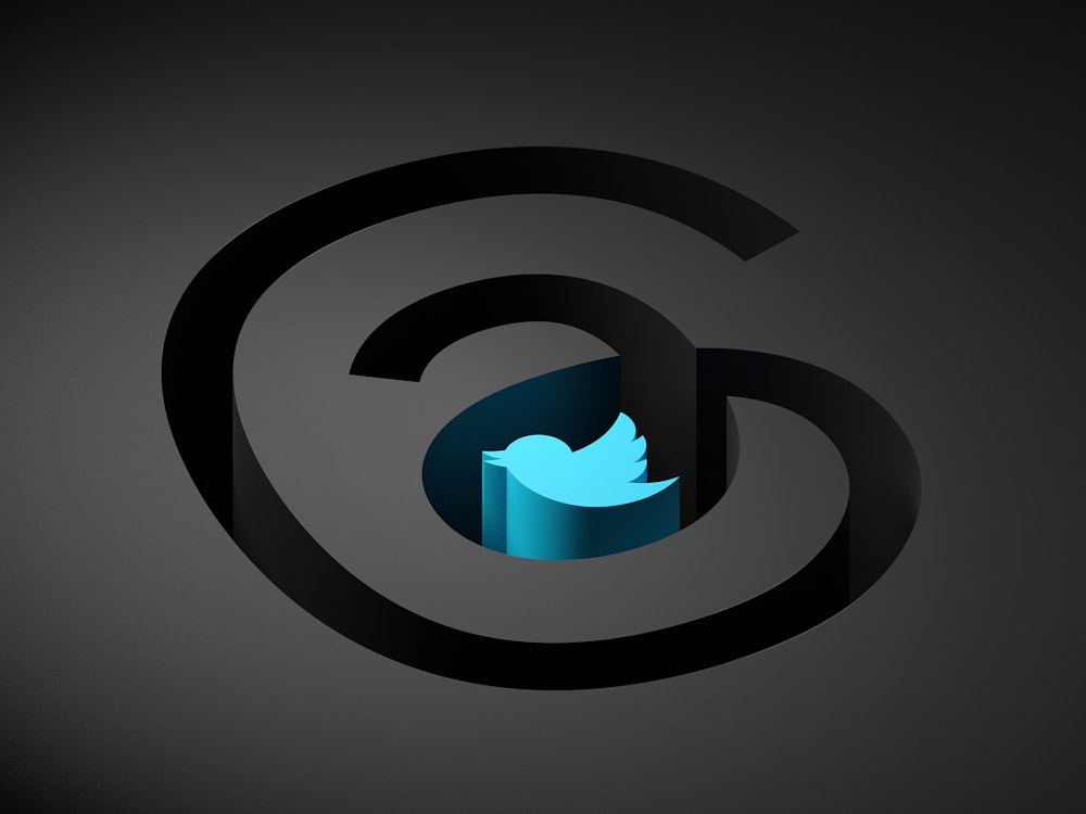a blue twitter logo on a black background