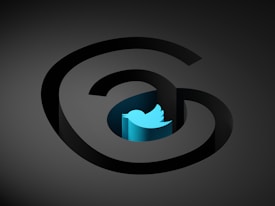 A stylized black spiral logo encircles a three-dimensional blue bird icon at the center, set against a dark background.