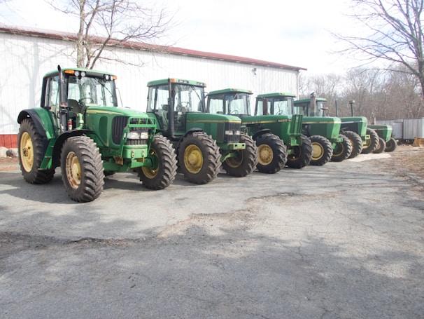 An array of lawn and garden tractors lined up for sale.
