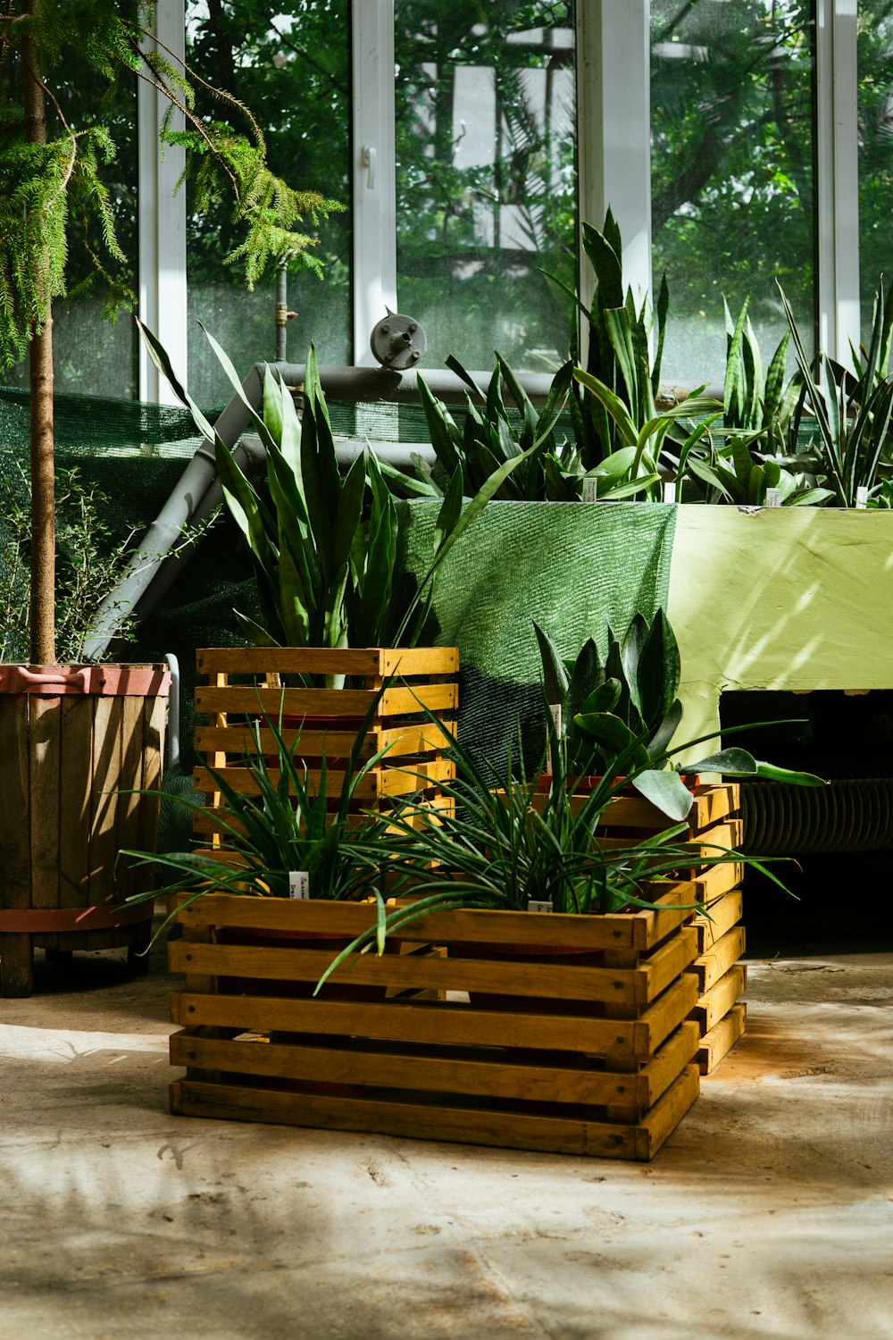 a couple of wooden planters sitting next to each other