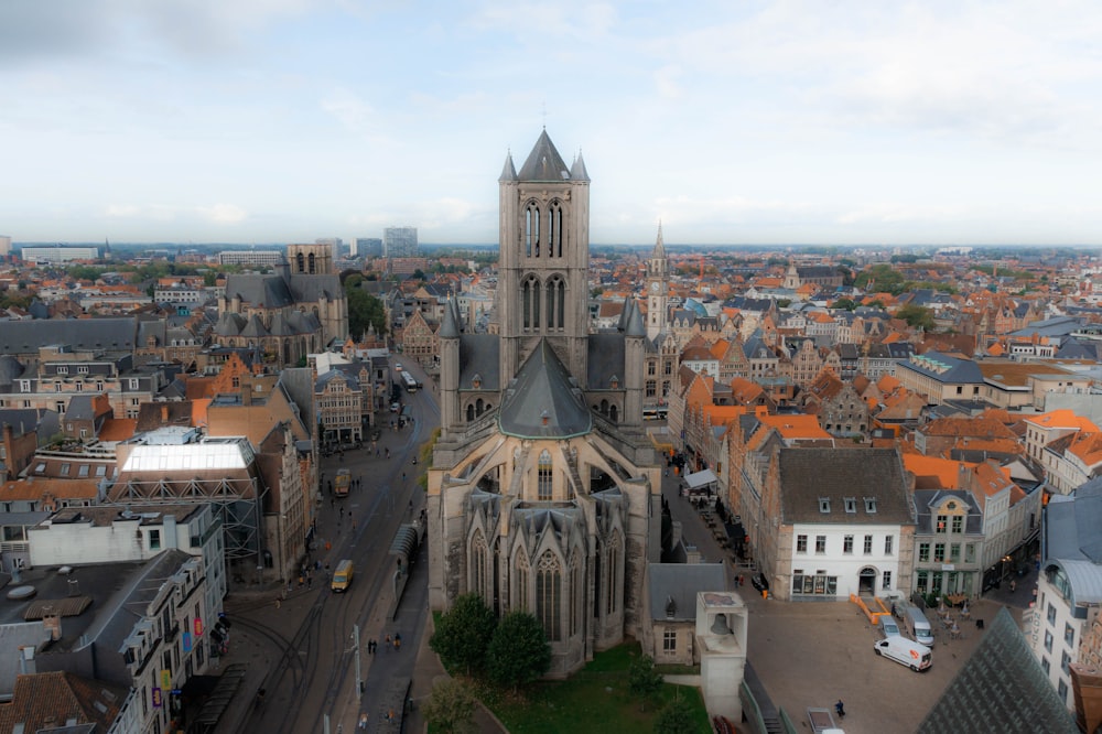 a large cathedral towering over a city filled with tall buildings