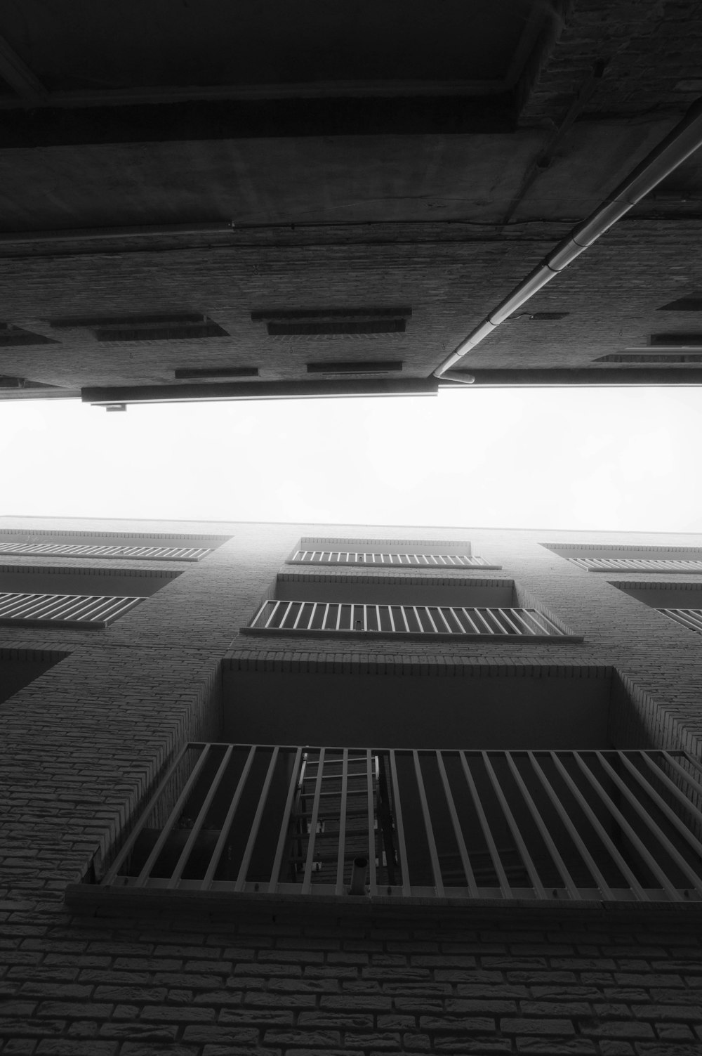 a black and white photo of a brick building