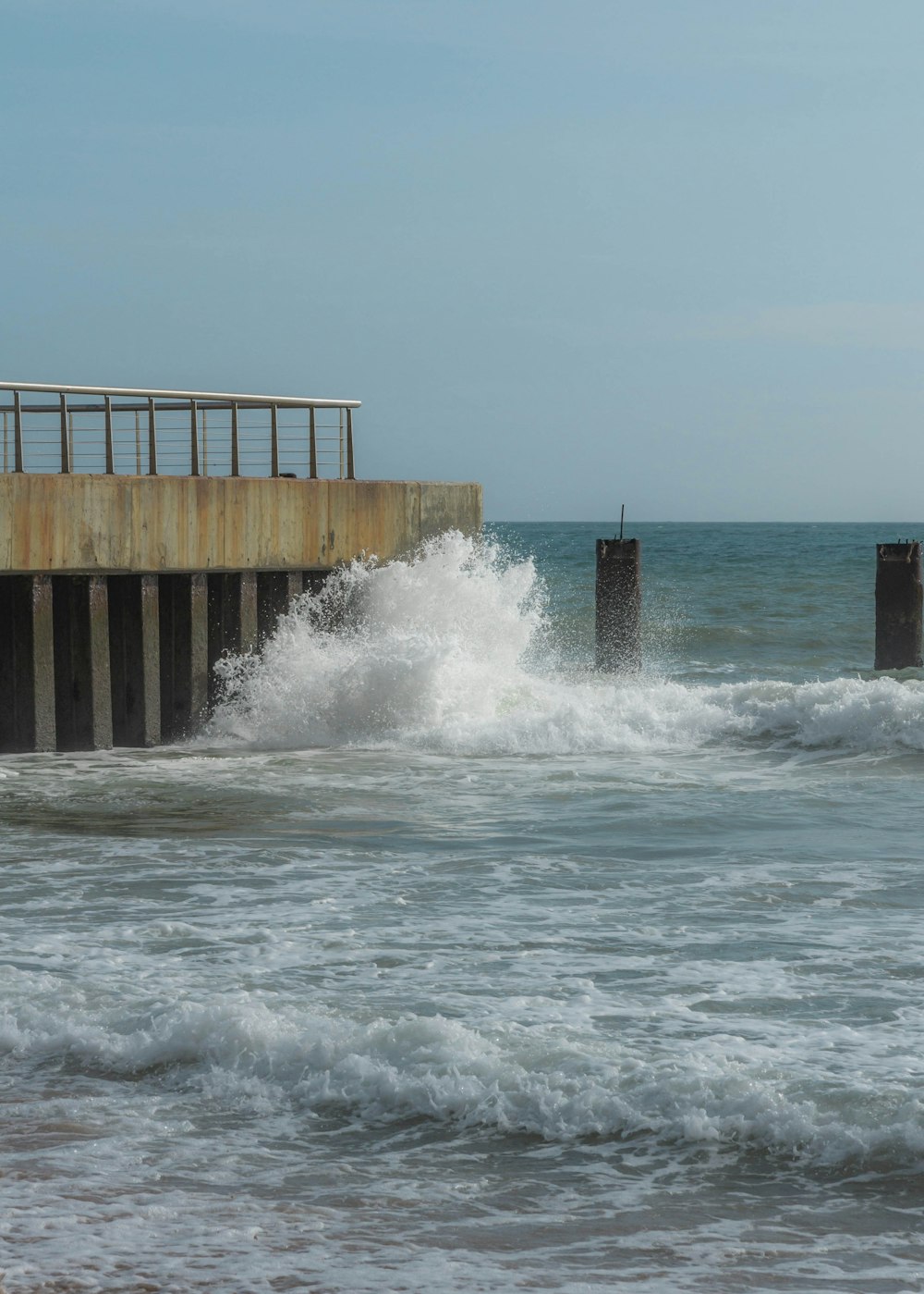 a large body of water next to a pier