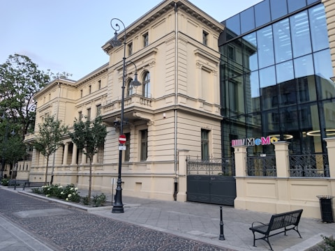 Historic building adapted with modern features and green spaces.