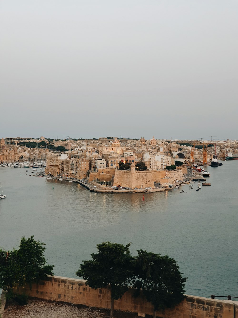 a large body of water with a city in the background