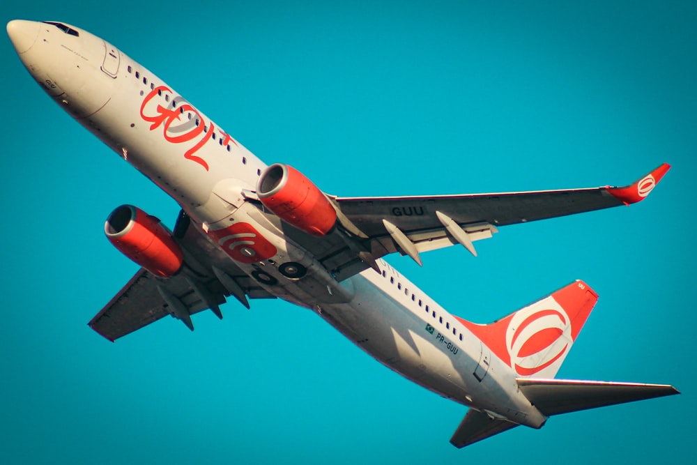 a large jetliner flying through a blue sky