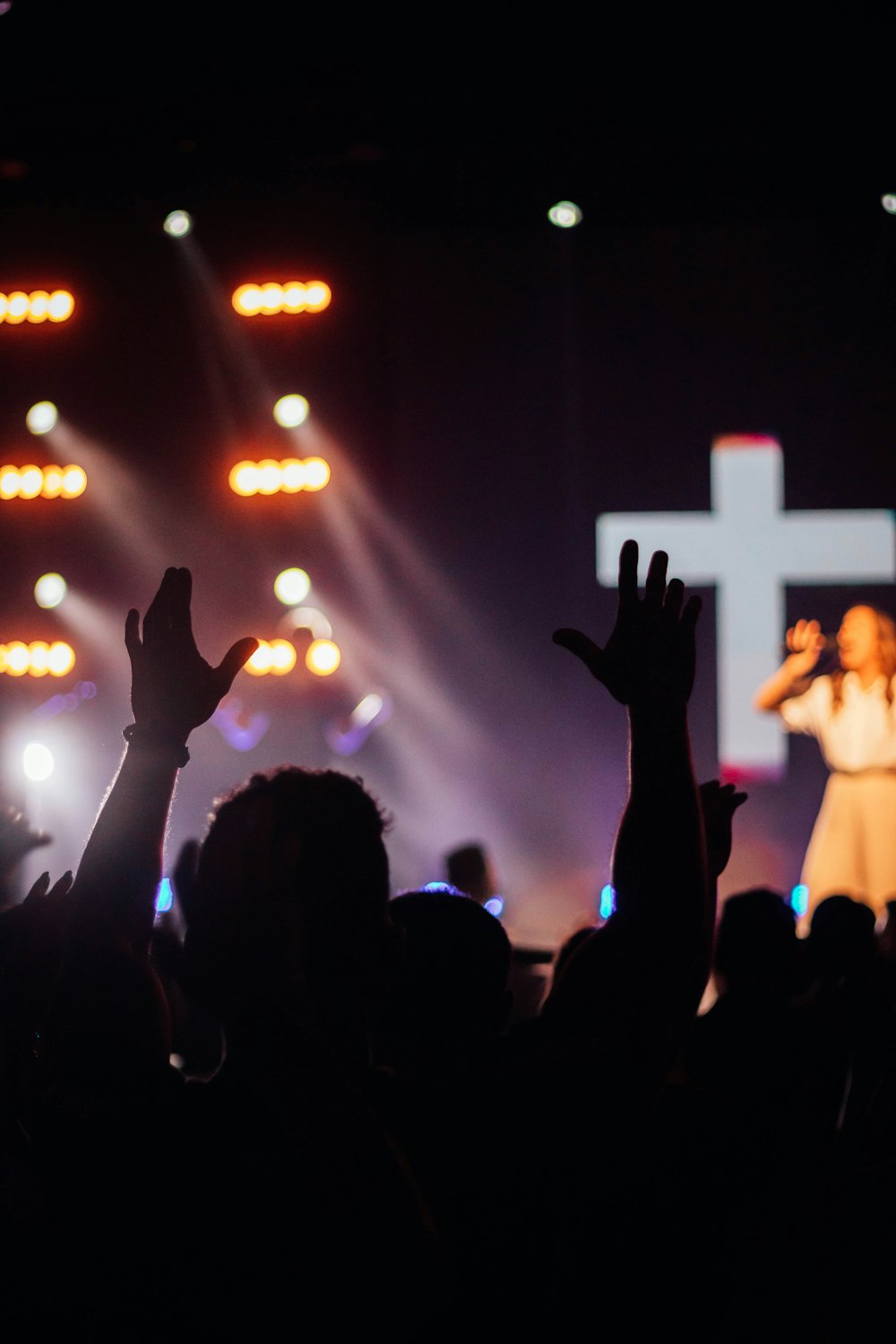 a group of people standing on top of a stage