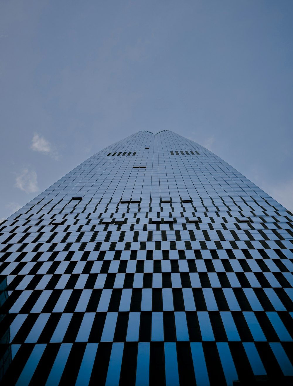 a tall building with a checkered design on it