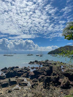 a group of boats floating on top of a body of water