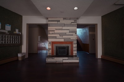 a living room with a fireplace and a fire place