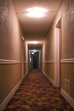 Elegant hallway with a long runner carpet in soft cream tones.