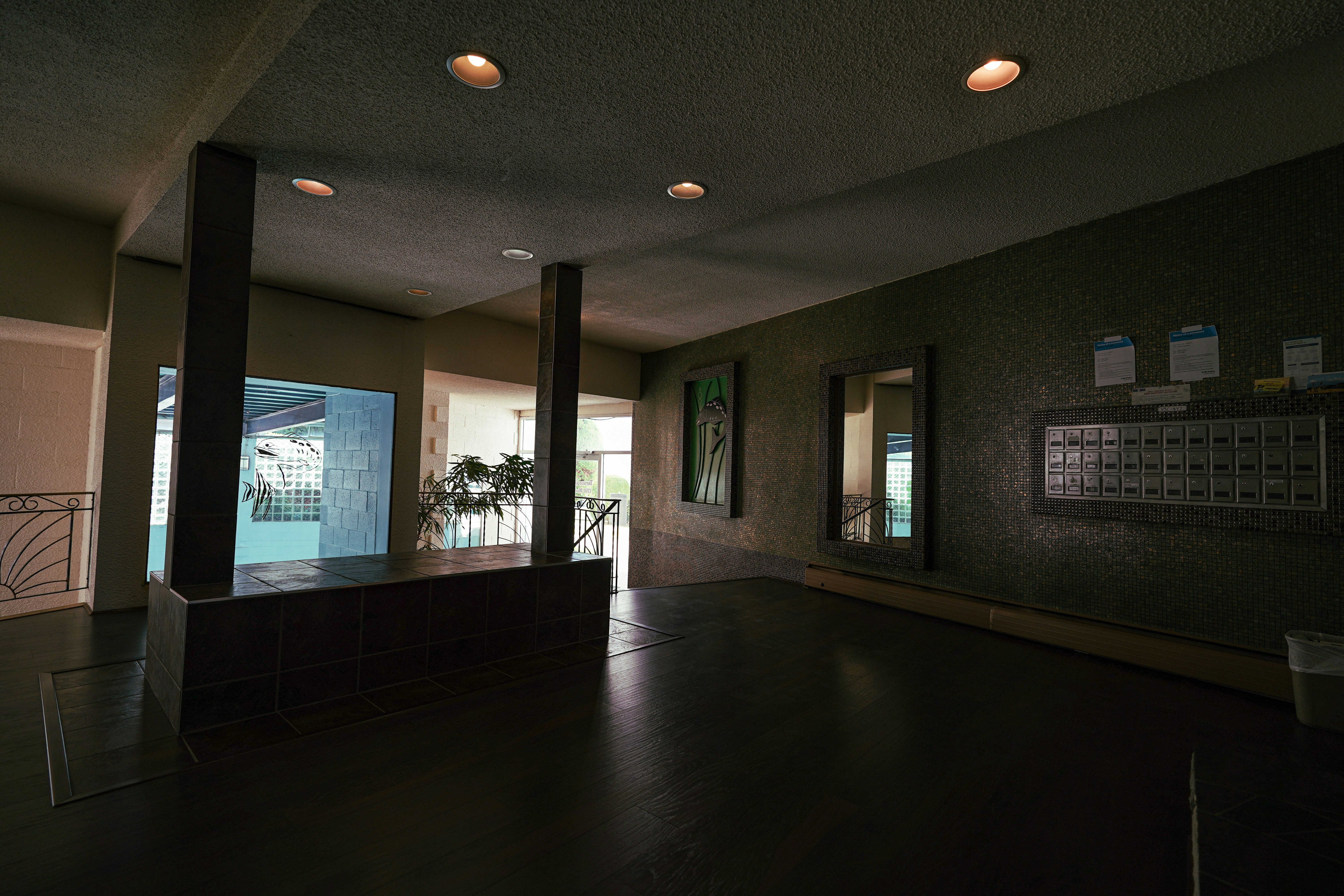 an empty room with a large wooden floor