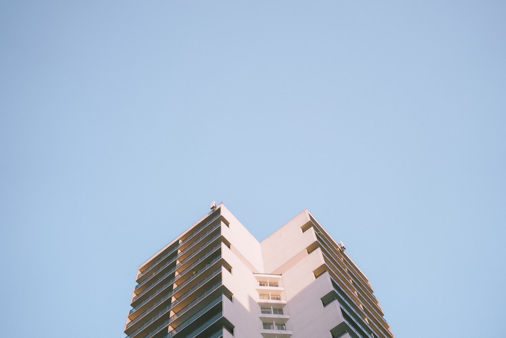 a very tall building with a sky background