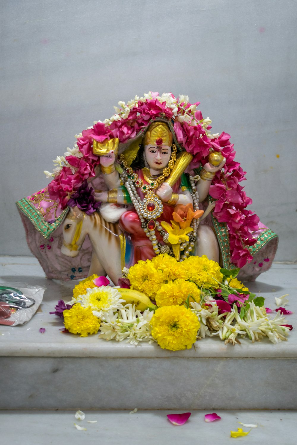 a statue of a woman sitting on a bench