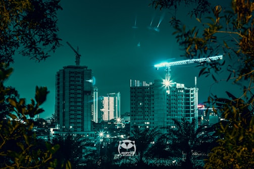 A bustling Nairobi skyline with cranes and data center buildings under construction at dusk.