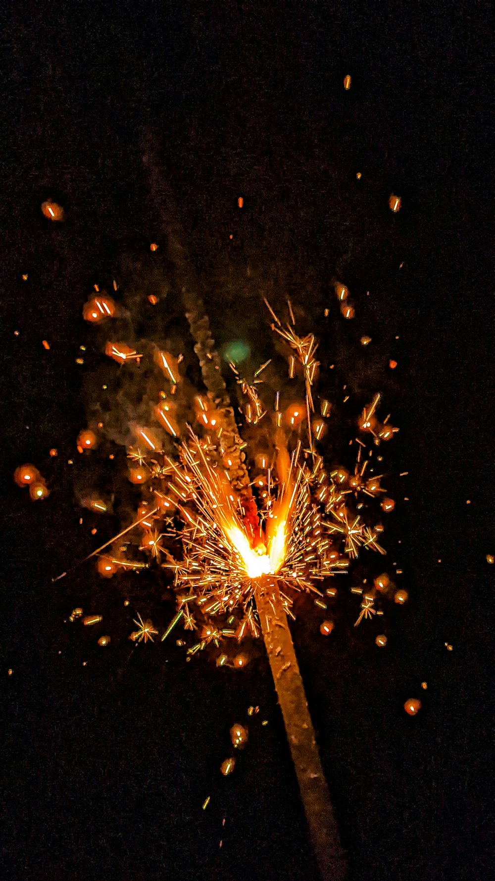 a sparkler that is lit up in the dark