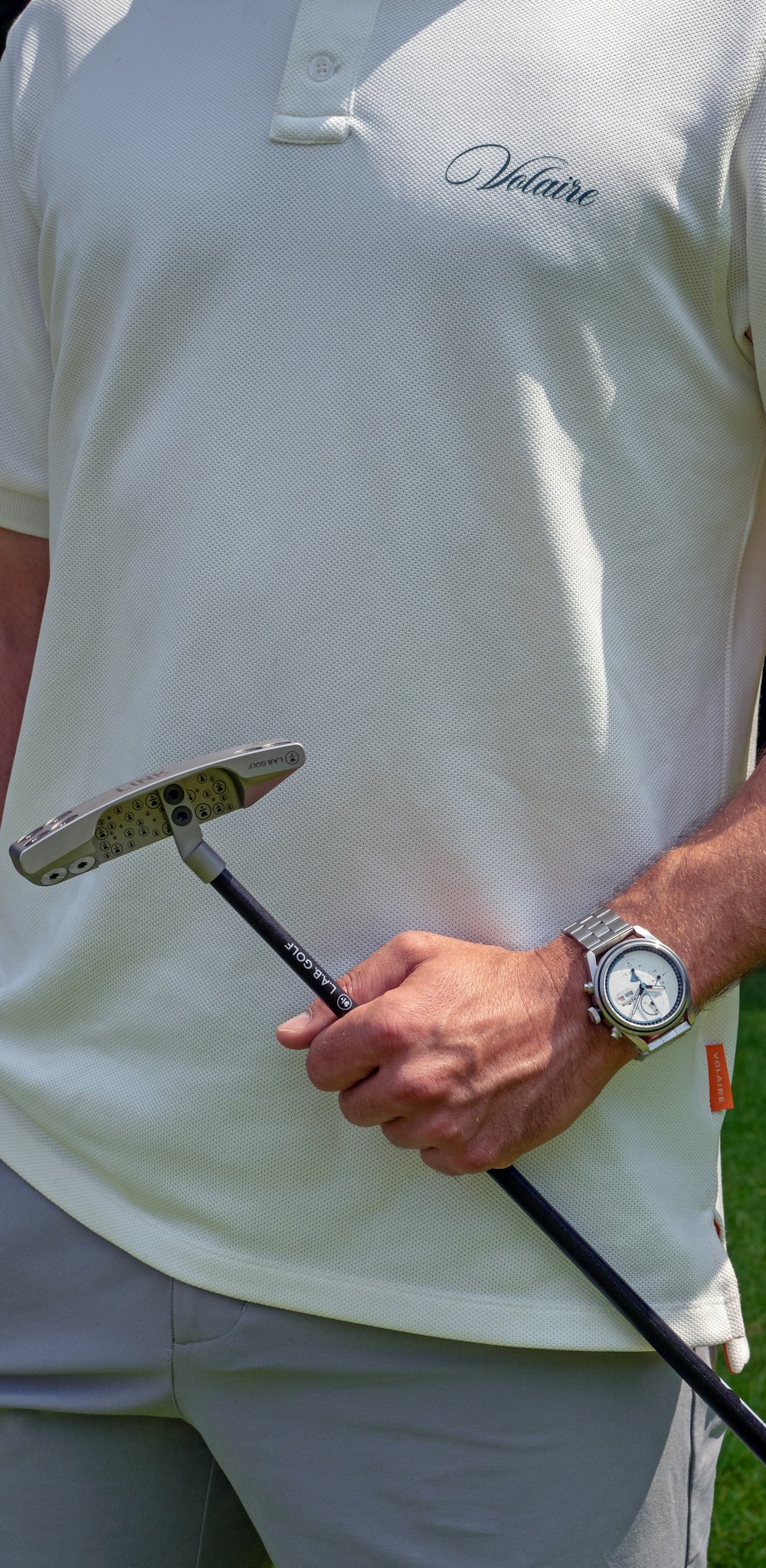 a close up of a person holding a tennis racquet
