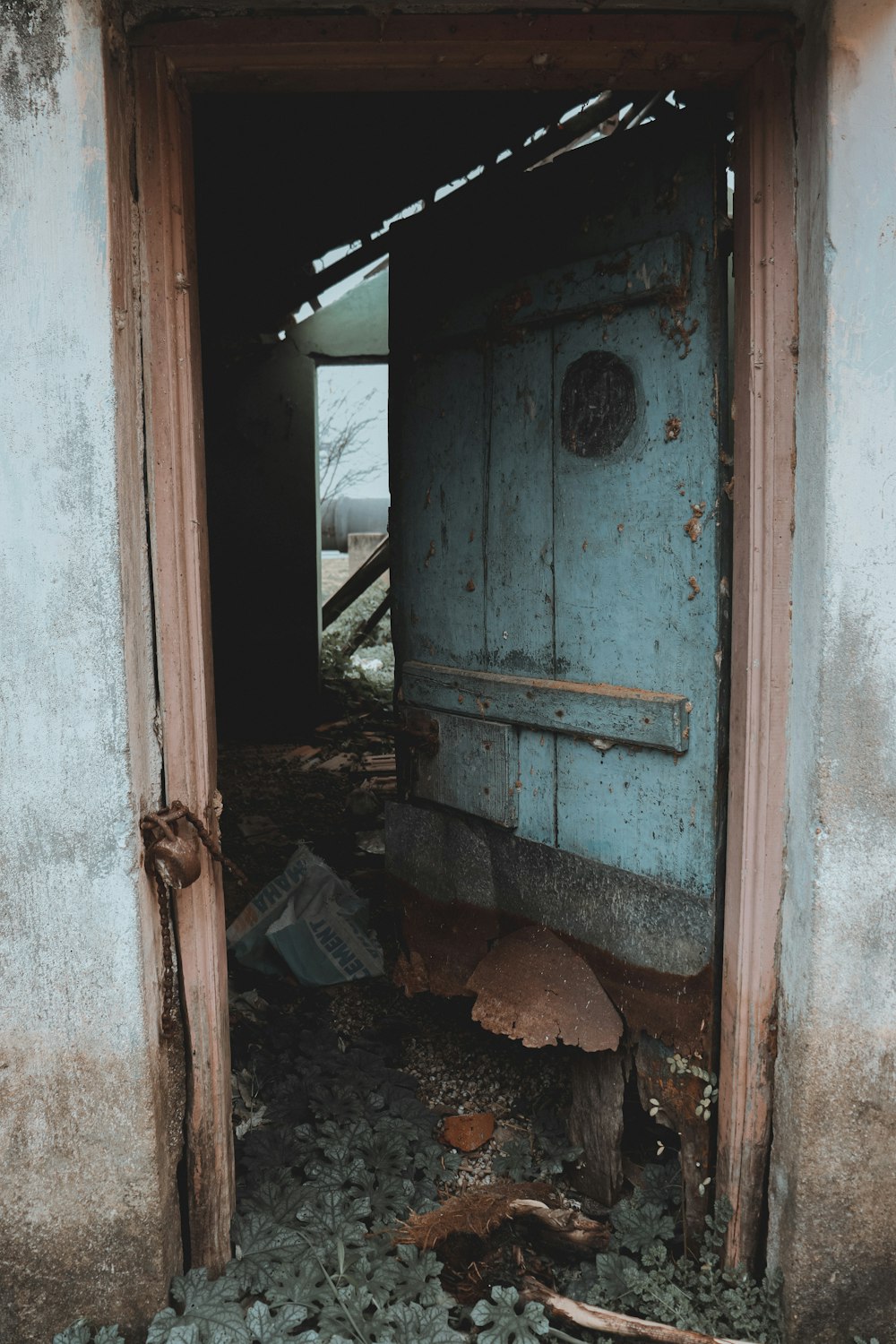 an open door to a run down building