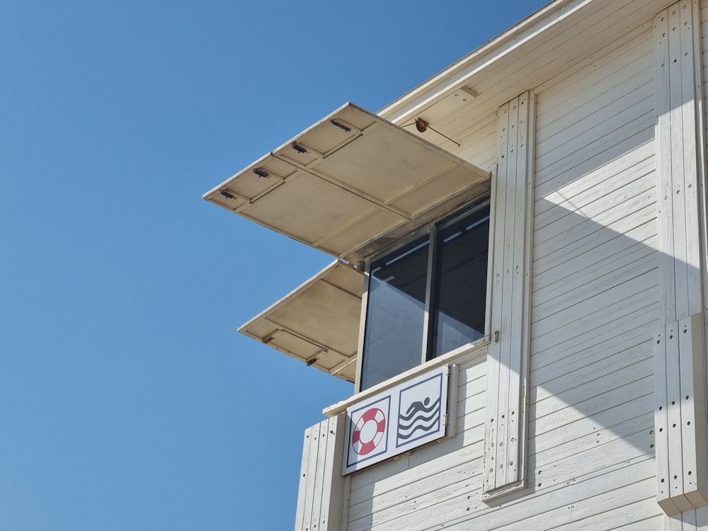 a white building with a sign on the side of it