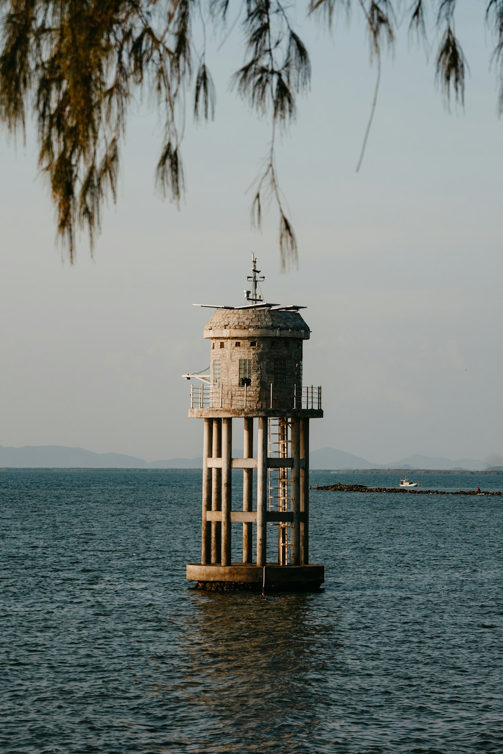 a tower in the middle of a body of water