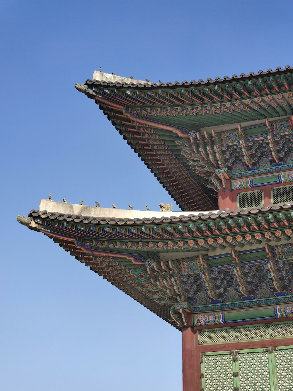 a tall building with a sky in the background