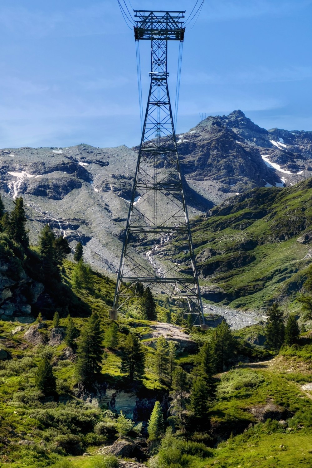 a view of a mountain range with a power line in the foreground