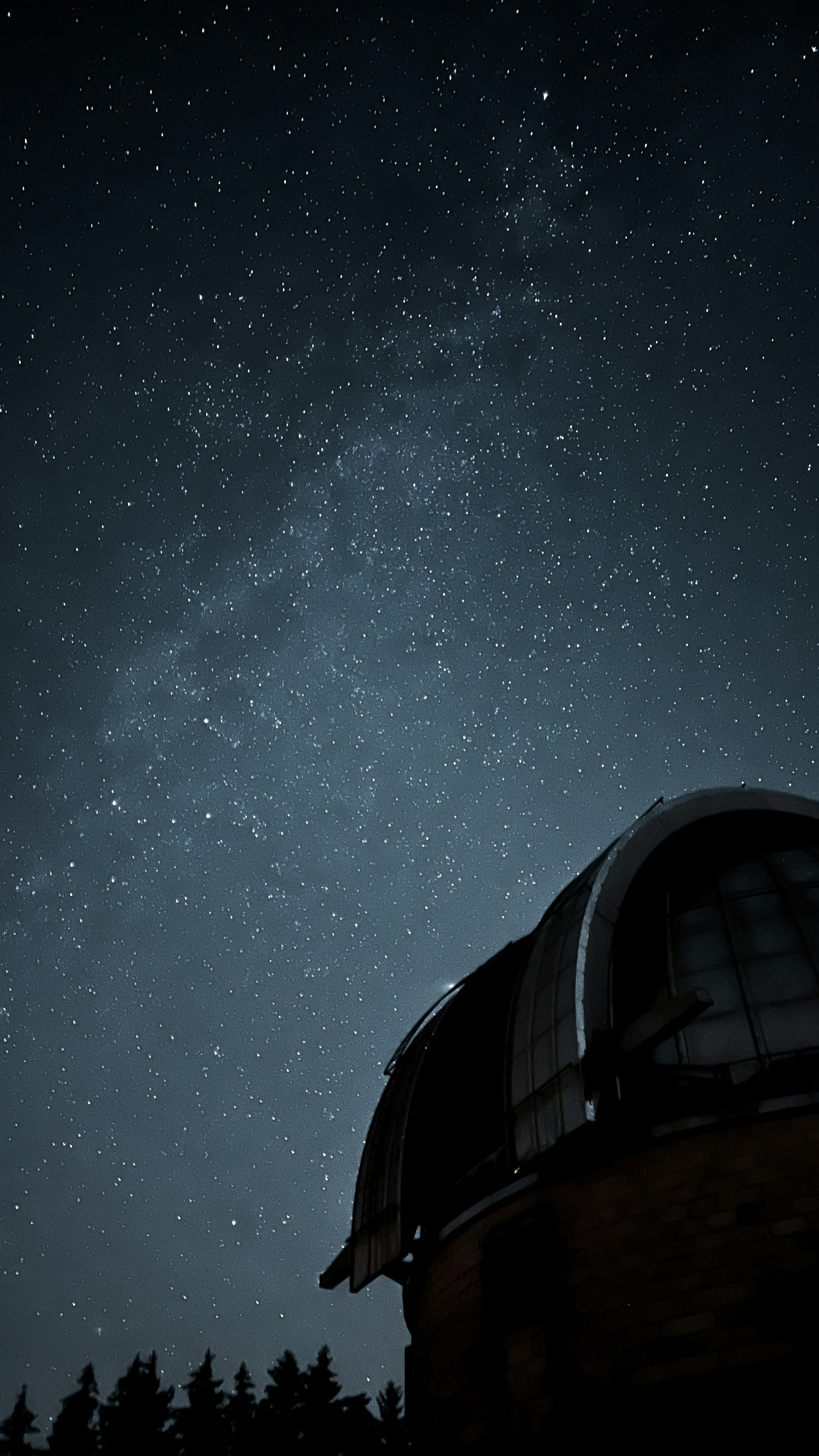 Observatory dome open to dark night sky, telescope silhouette, dramatic moody lighting, deep shadows