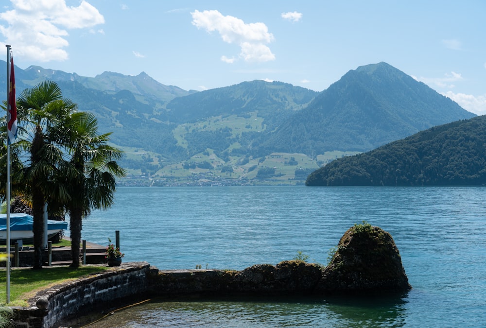 a body of water with mountains in the background