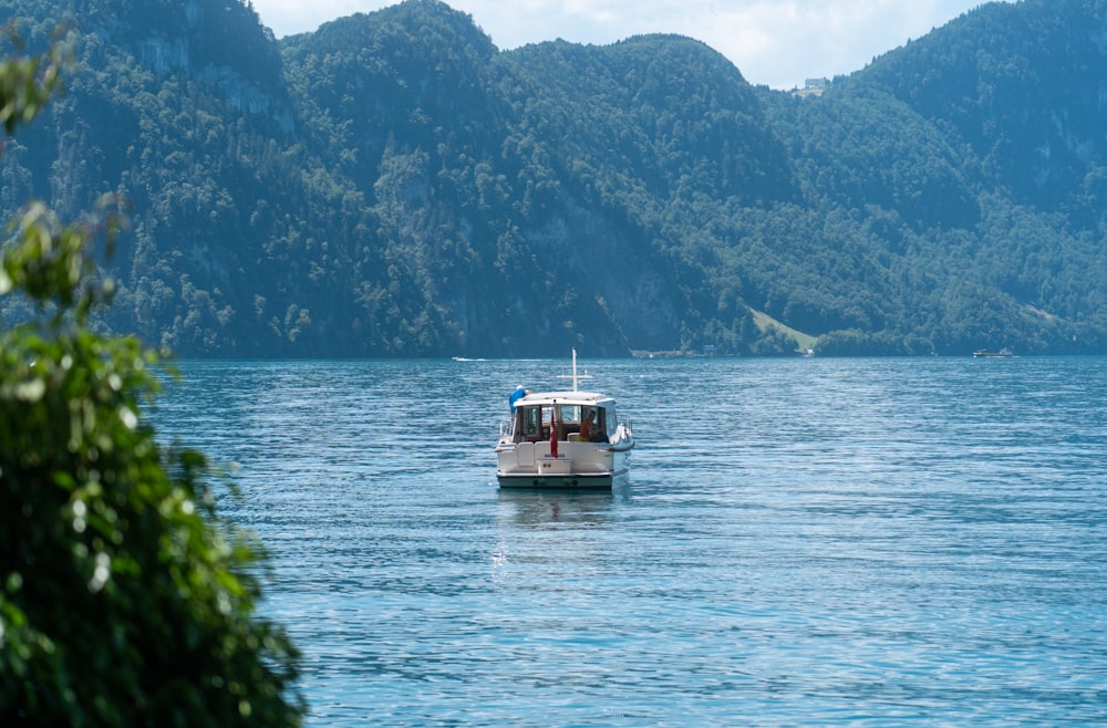 a boat floating on top of a large body of water