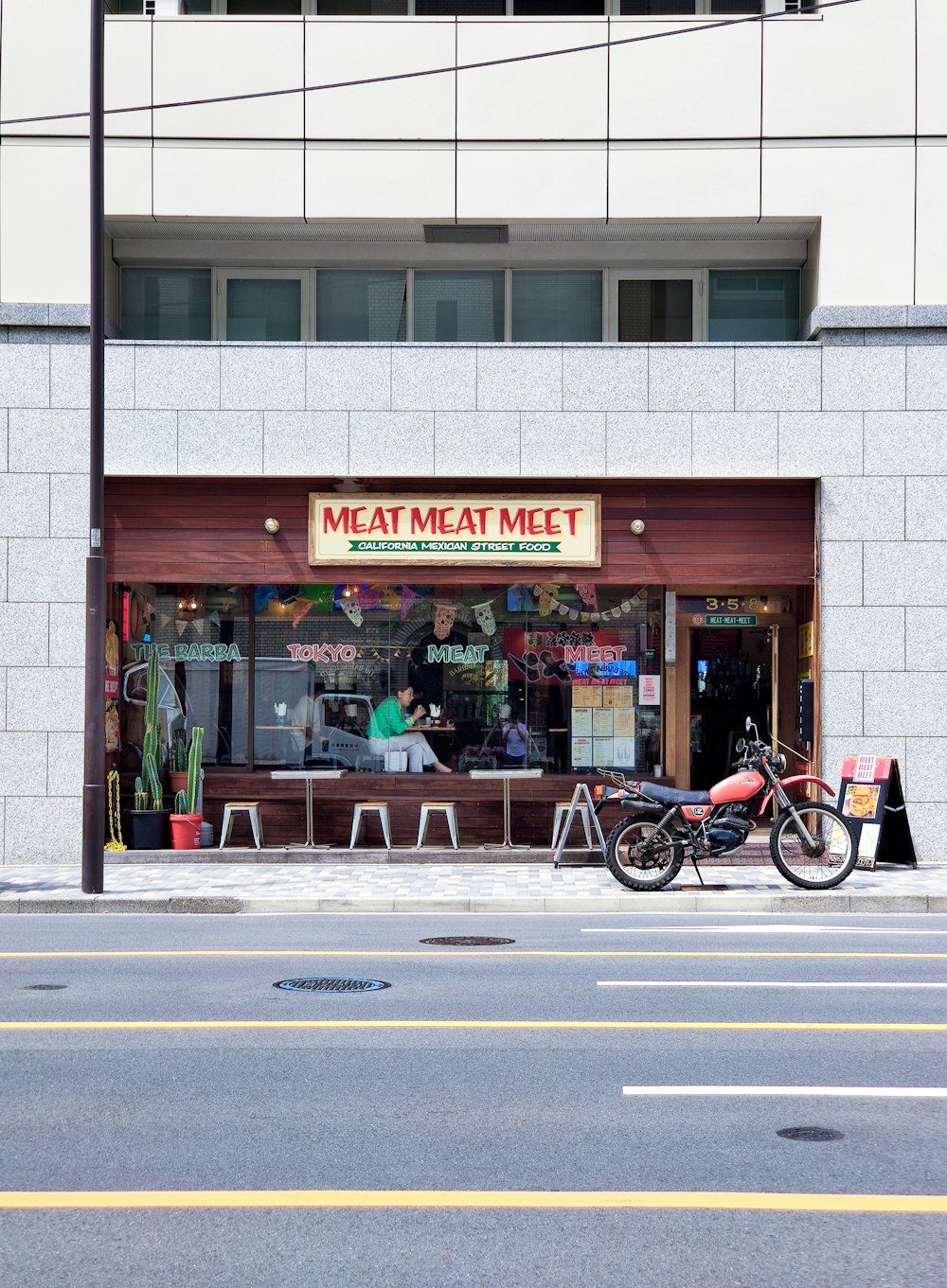 a bike parked in front of a restaurant