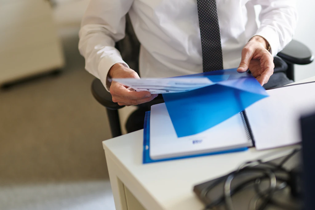 Licensed private investigator reviewing custody case documentation