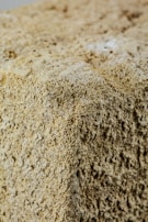 Close shot of a refractory block with visible ceramic grain structure.