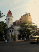 a large white building with a copper dome
