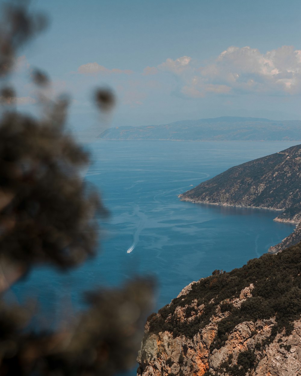 a view of a body of water from a hill