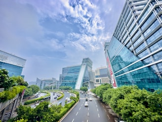 a city street with cars driving down it