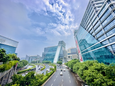 a city street with cars driving down it