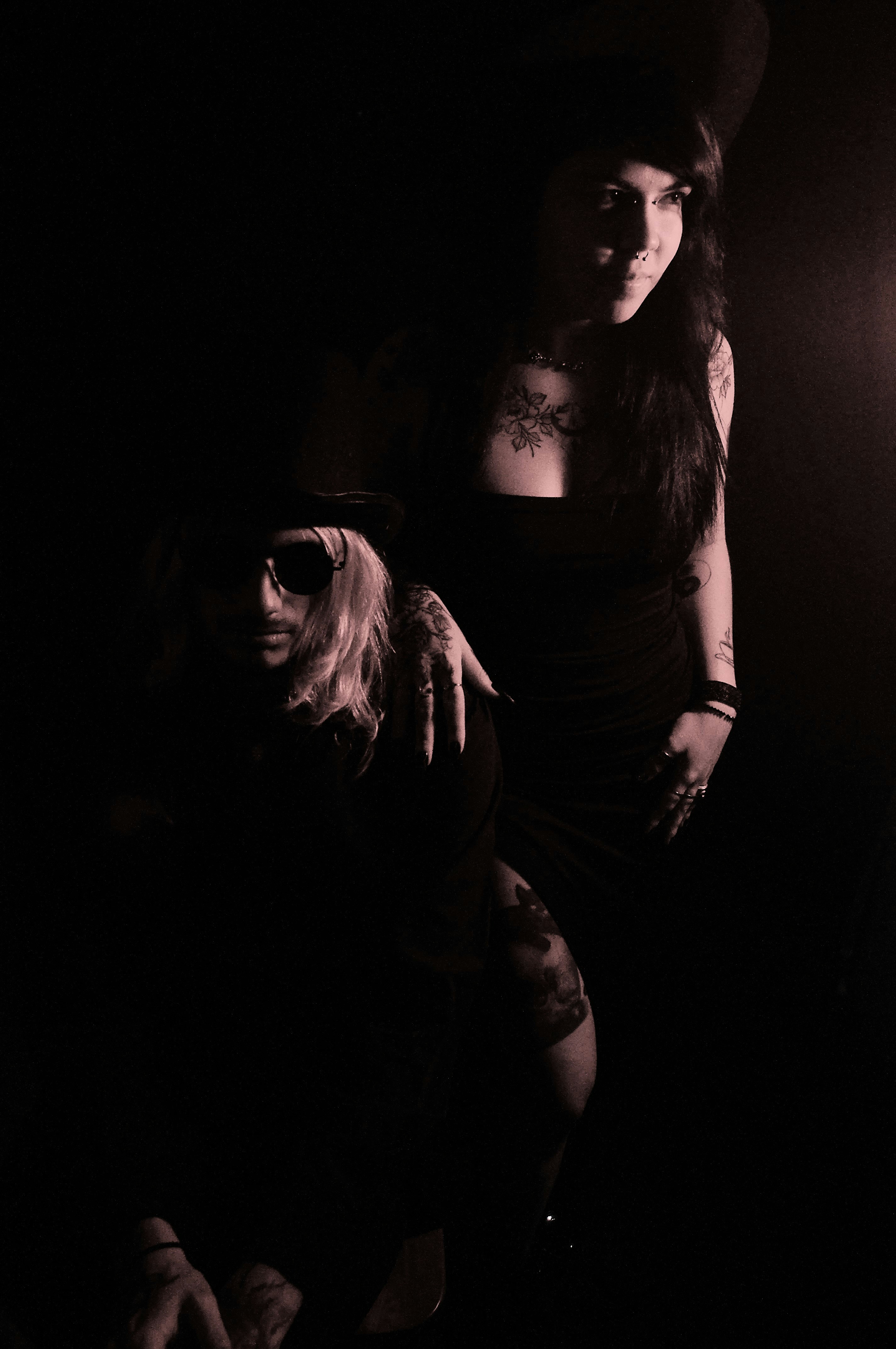 A man and a woman standing in the dark photo – Free Person Image on ...