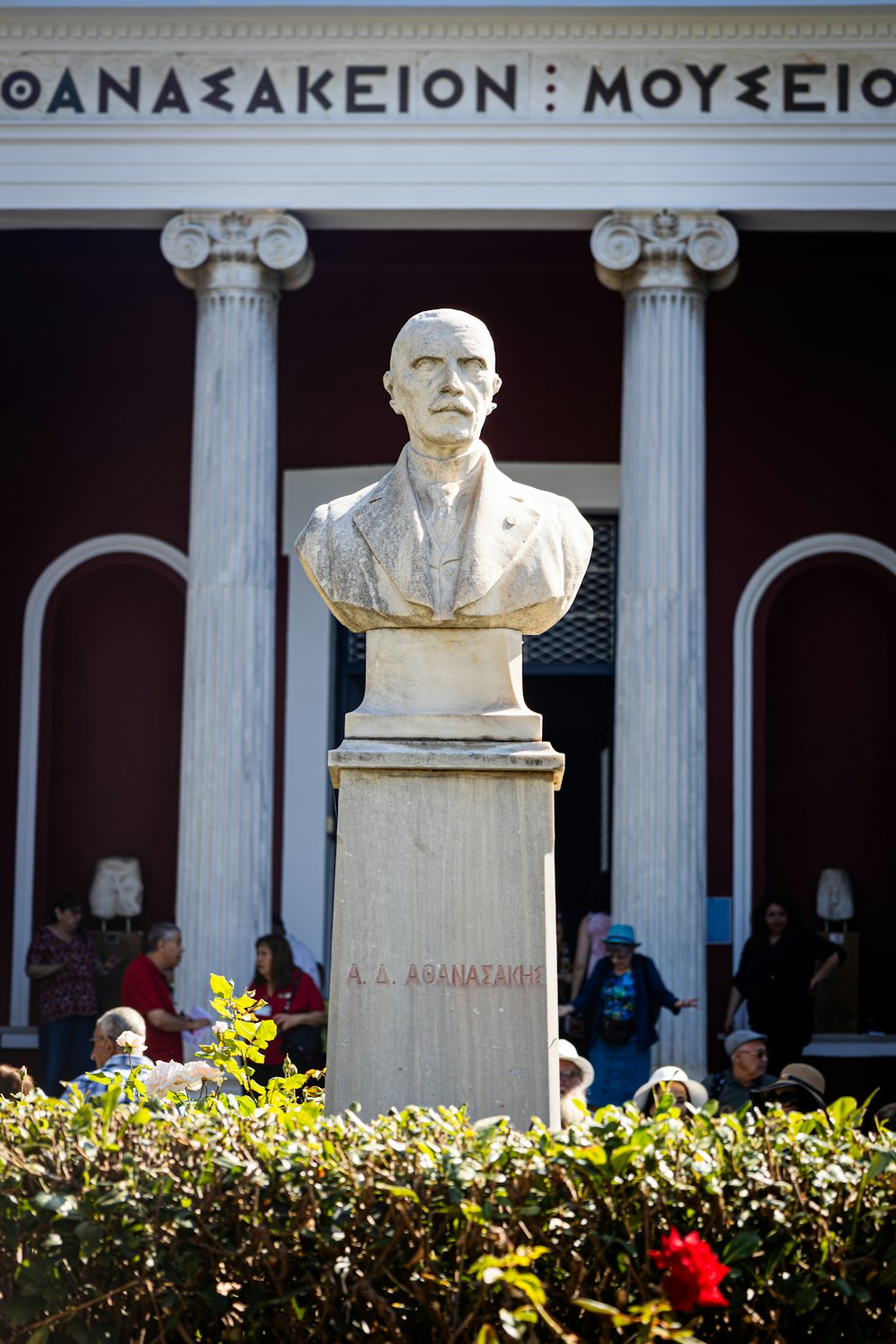 a statue of a man in front of a building