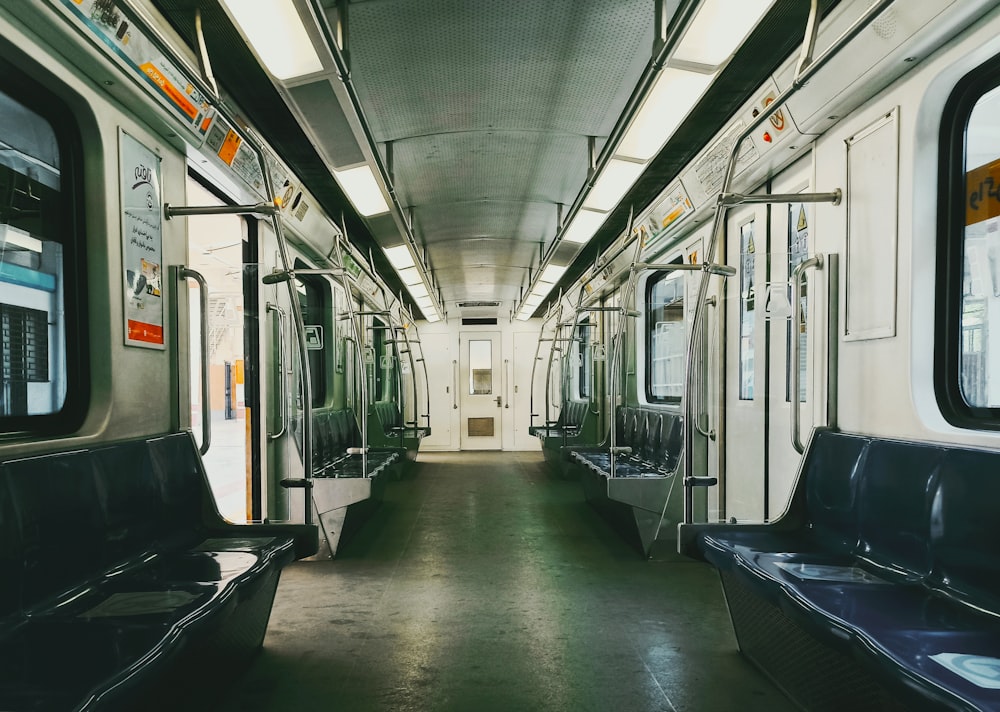 a subway car filled with lots of empty seats
