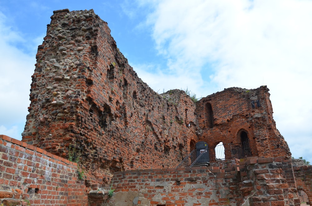 an old brick building with a bell tower