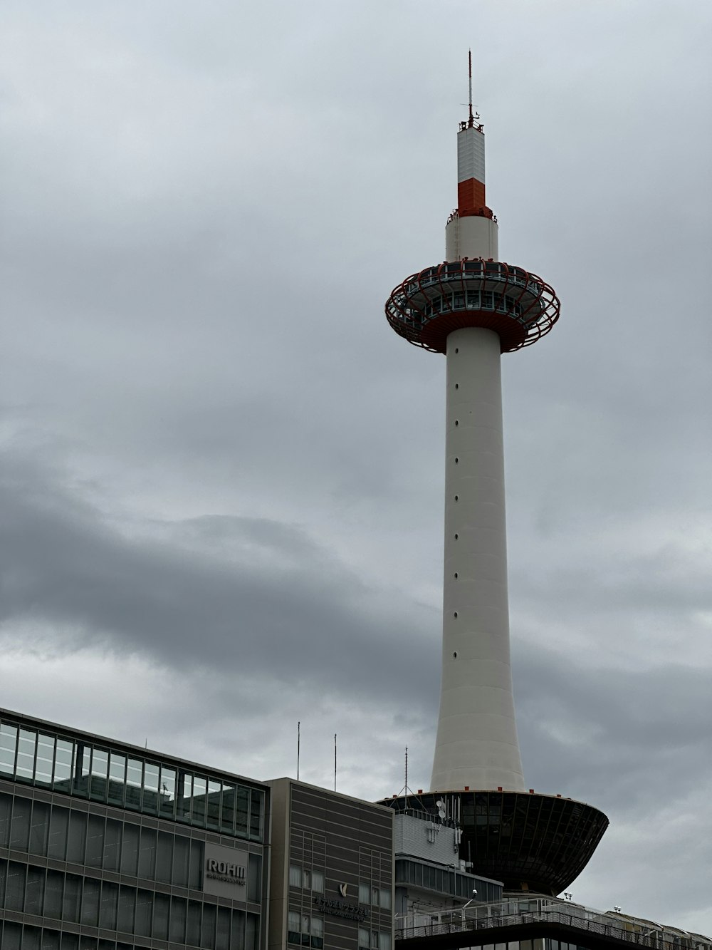 a very tall tower with a clock on it's side