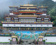 The majestic Rumtek Monastery with its vibrant colors and intricate architecture nestled in the mountains.