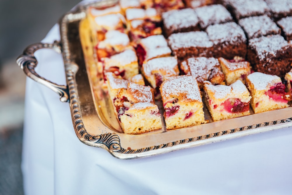 a tray of desserts sitting on top of a table