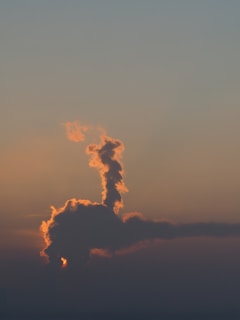A roaring T-Rex standing against a moody prehistoric sky filled with swirling clouds.