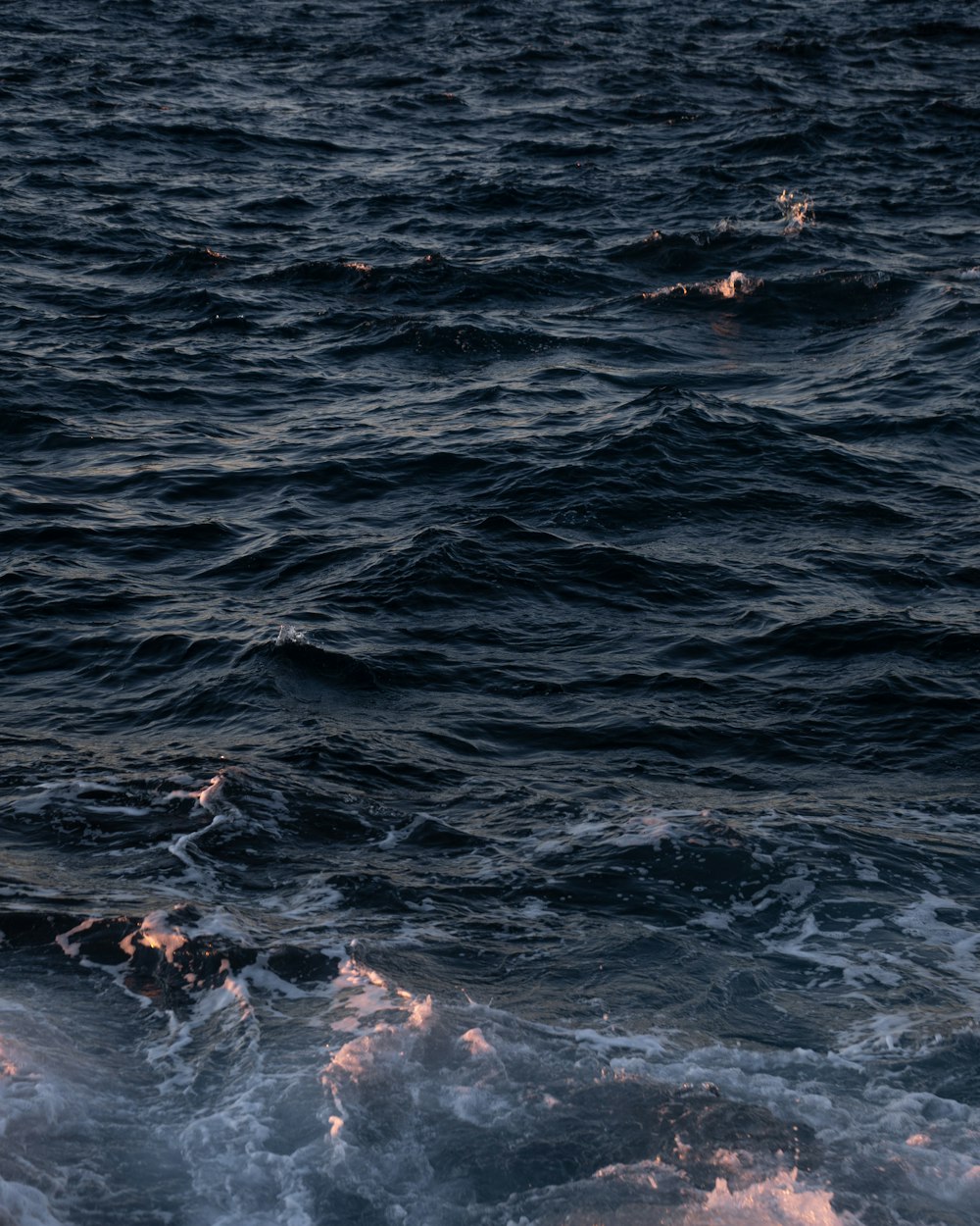 a person riding a surf board on a body of water