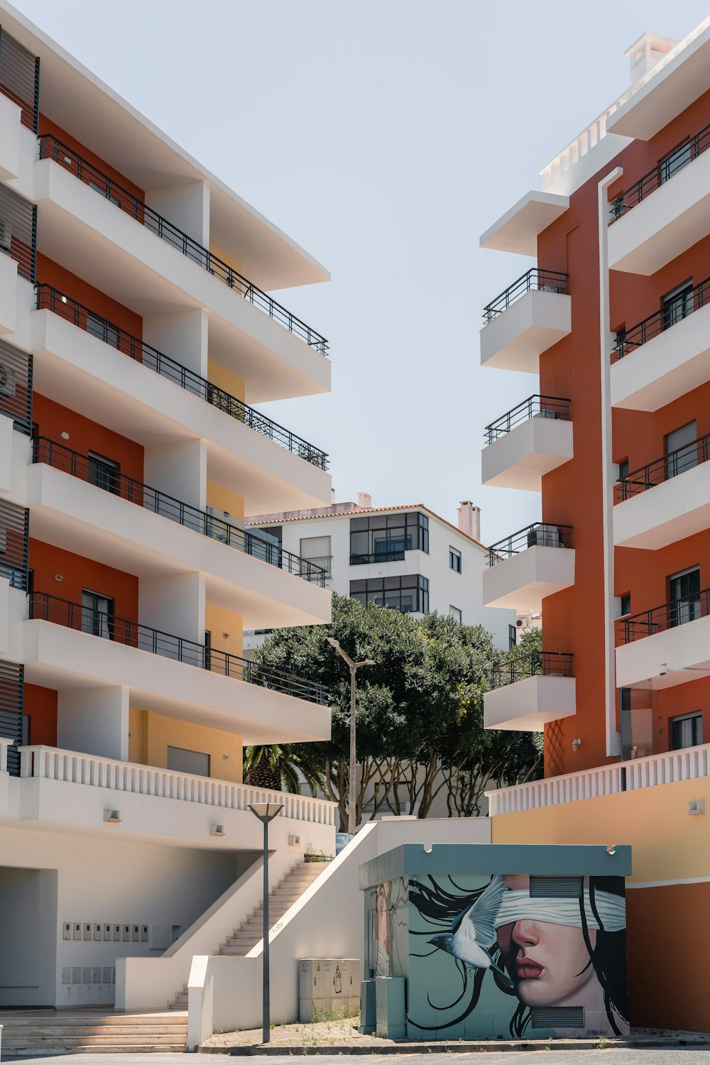 a tall building with balconies and balconies painted on it