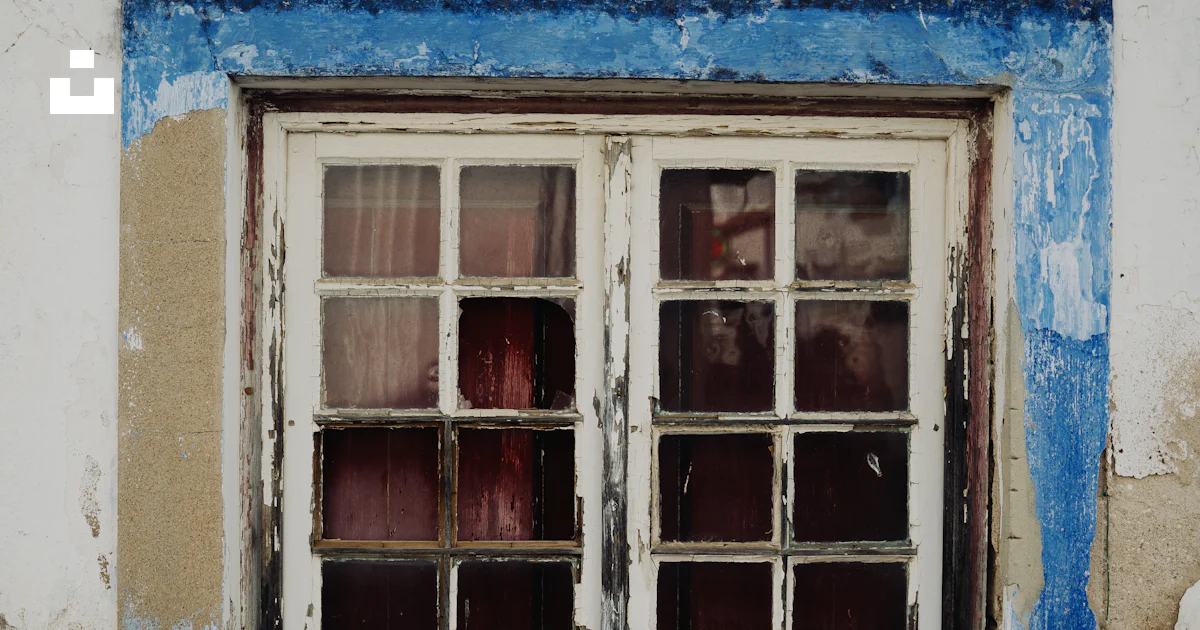 A blue and white wall with two windows photo – Free Window Image on ...